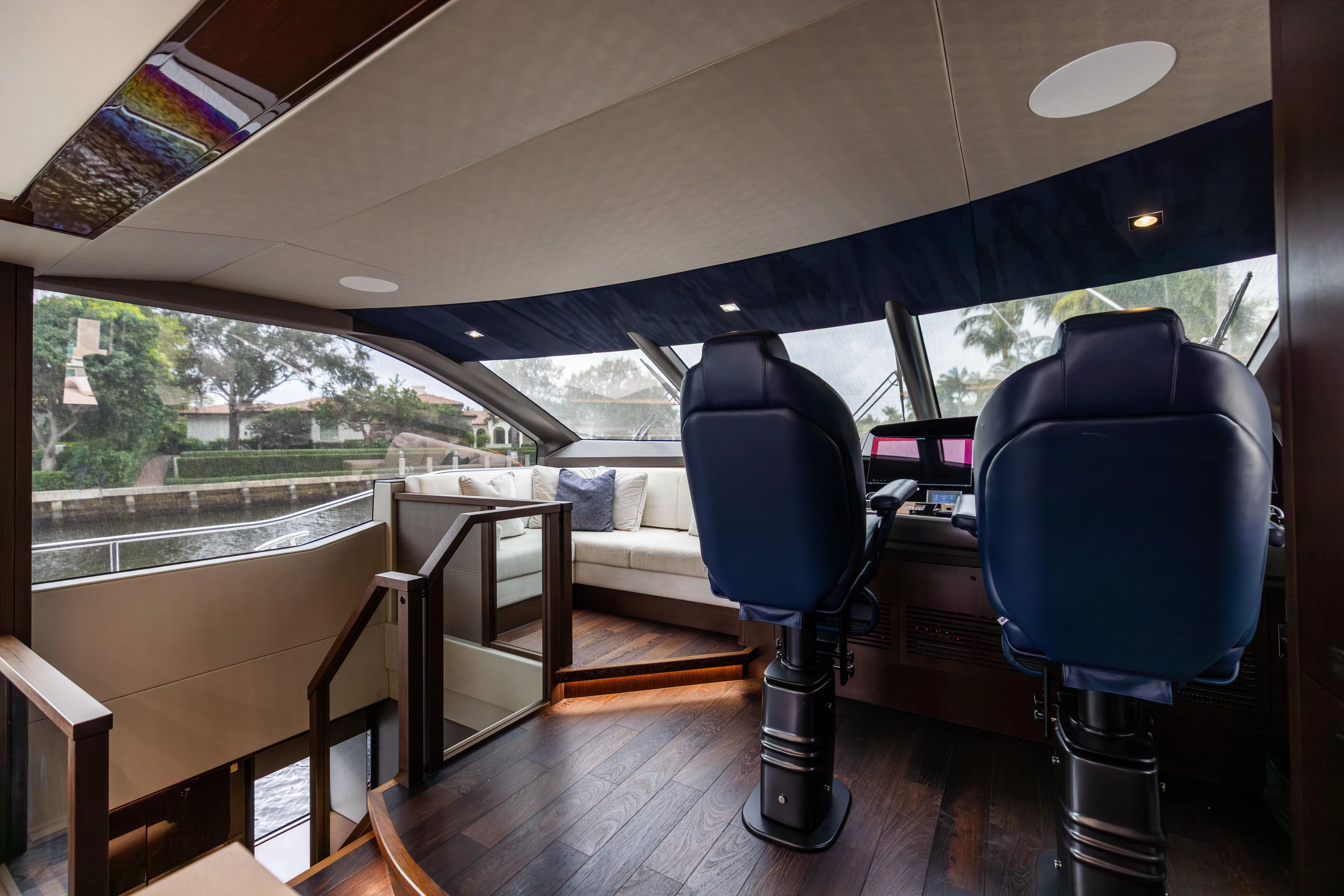 Journey Yacht Photos Pics Luxurious interior of 2019 Sunseeker 76 yacht with plush seating and modern helm.