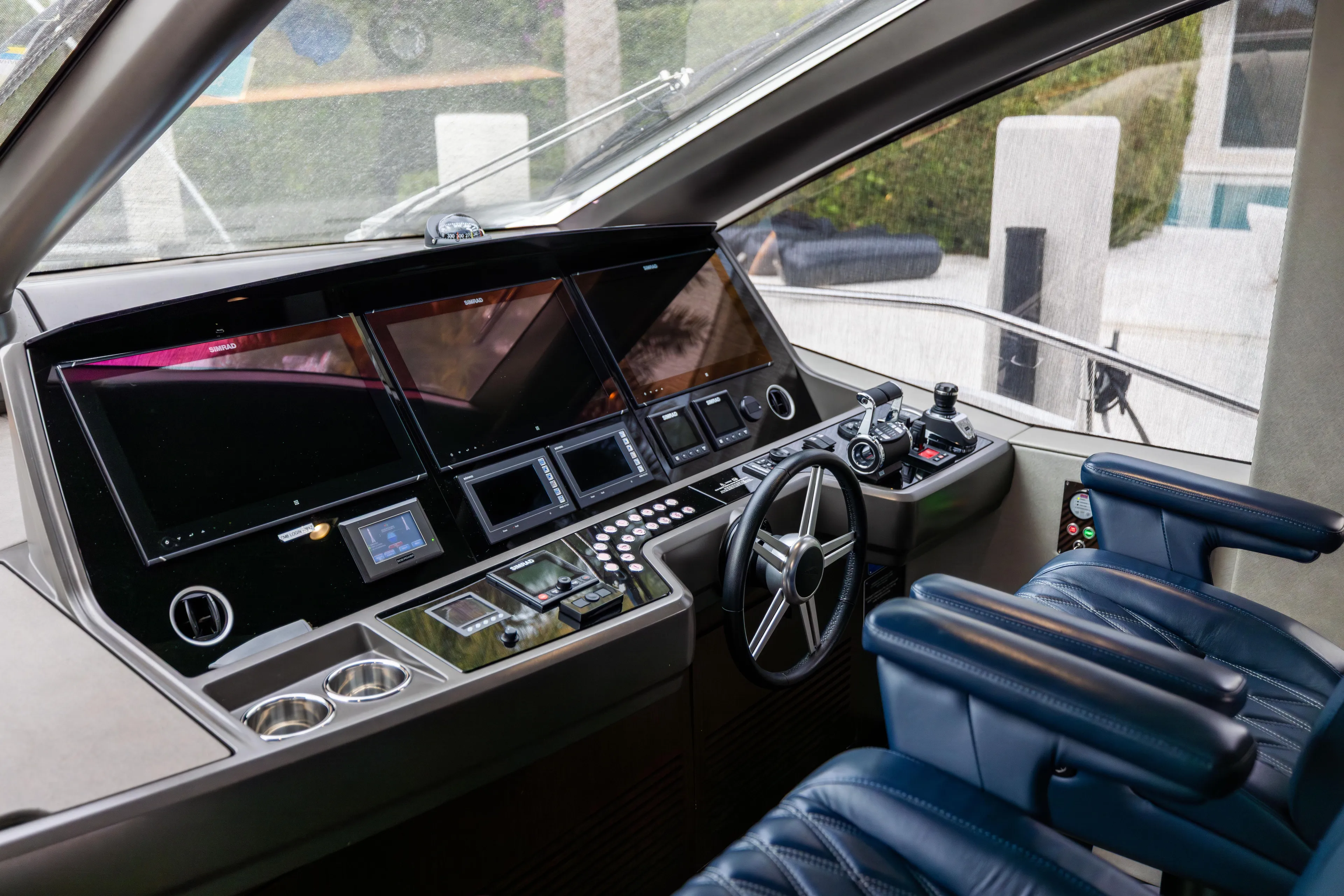 Journey Yacht Photos Pics Cockpit of 2019 Sunseeker 76 yacht with advanced navigation controls and luxurious seating.