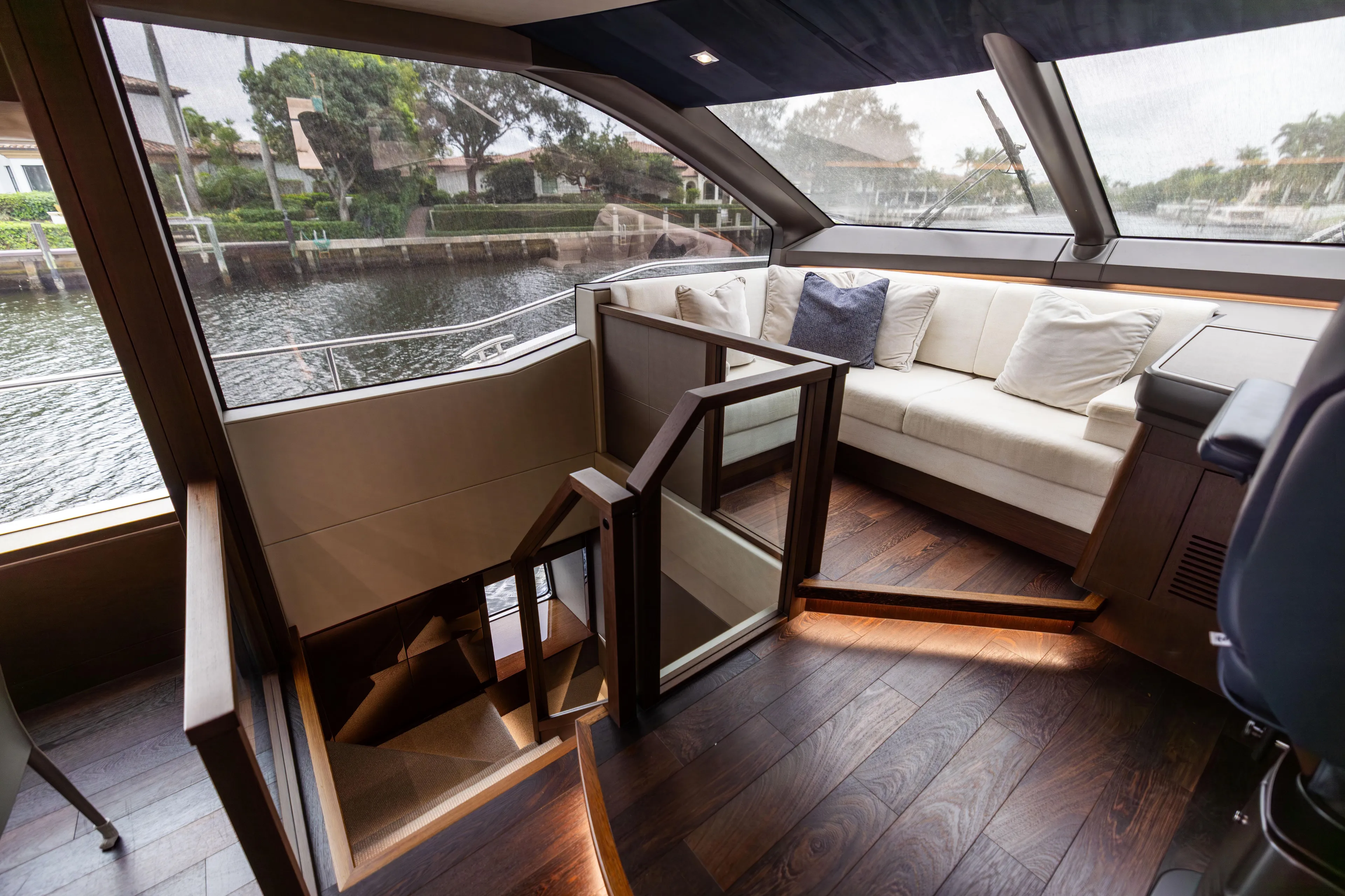 Journey Yacht Photos Pics Luxurious interior of 2019 Sunseeker 76 yacht with elegant seating and wooden flooring.