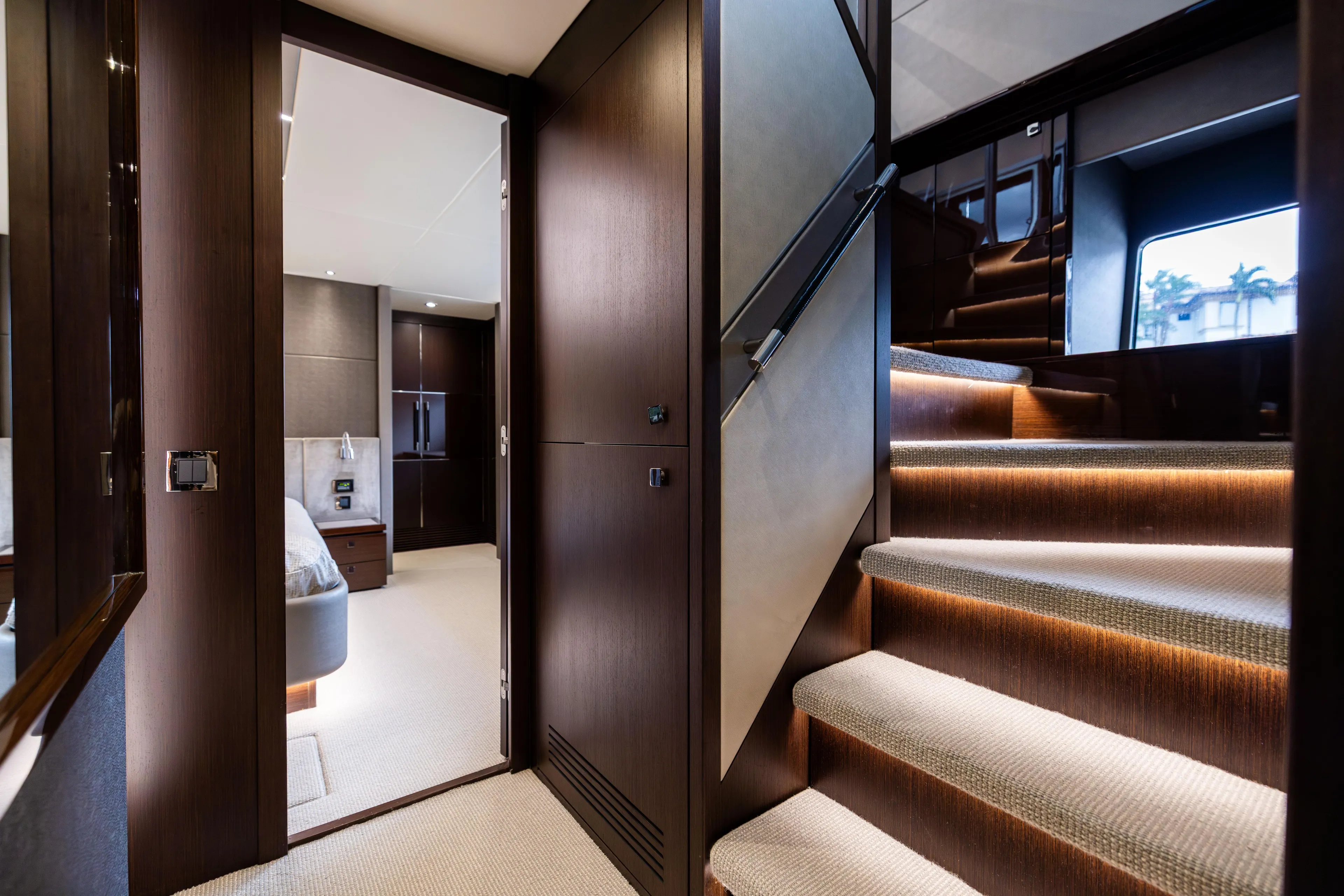 Journey Yacht Photos Pics Luxurious interior of 2019 Sunseeker 76 yacht, featuring elegant staircase and modern bedroom.
