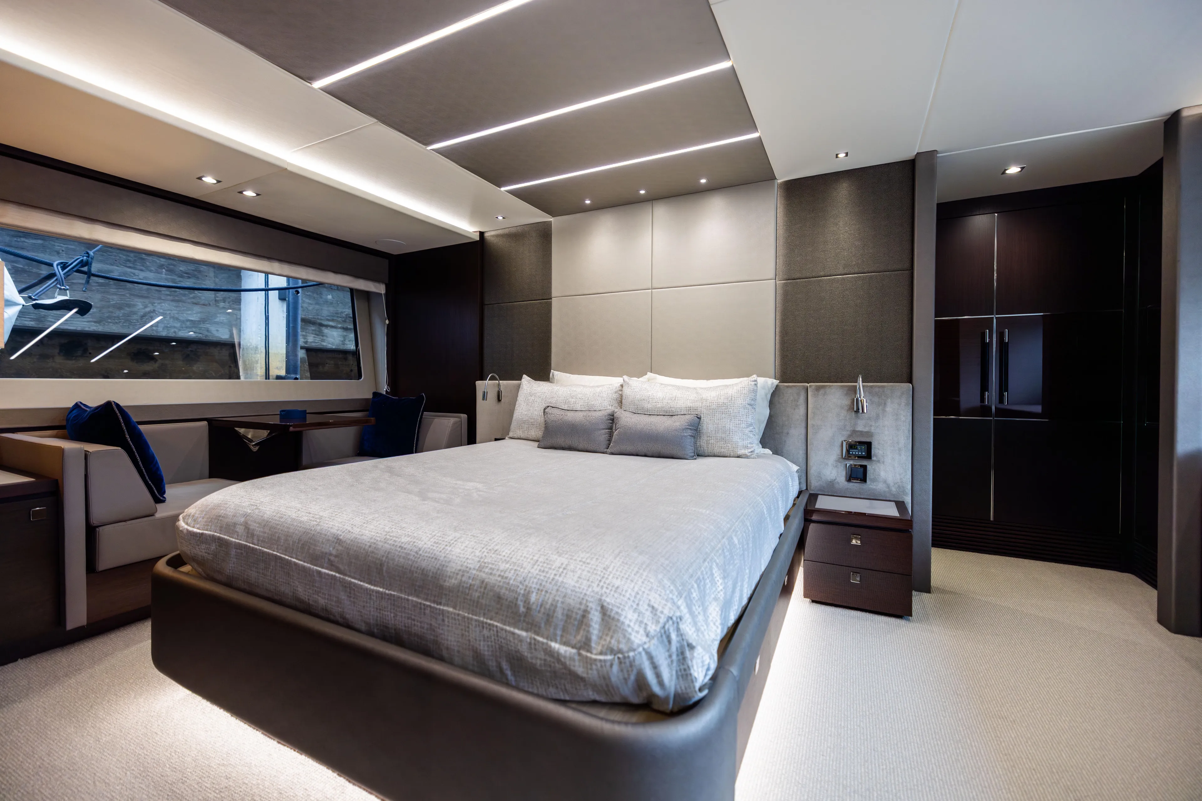 Journey Yacht Photos Pics Luxurious Sunseeker 76 yacht bedroom interior, 2019 model, featuring modern design and elegant furnishings.
