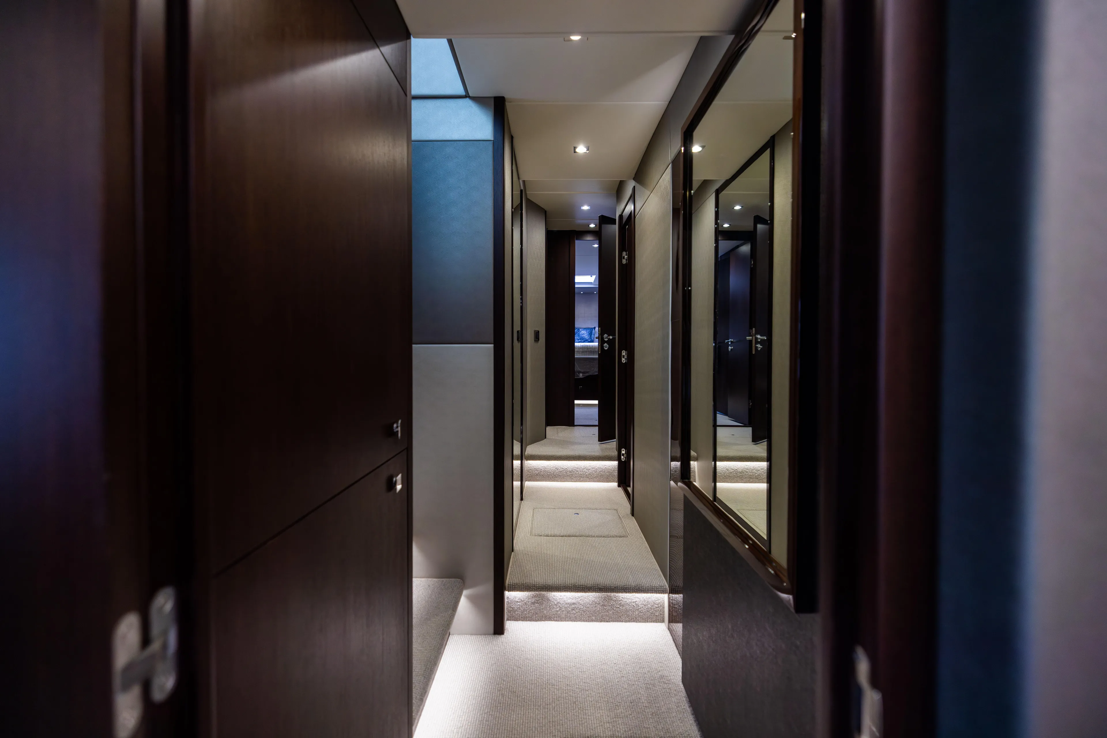 Journey Yacht Photos Pics Luxurious interior hallway of 2019 Sunseeker 76 yacht with modern design elements.