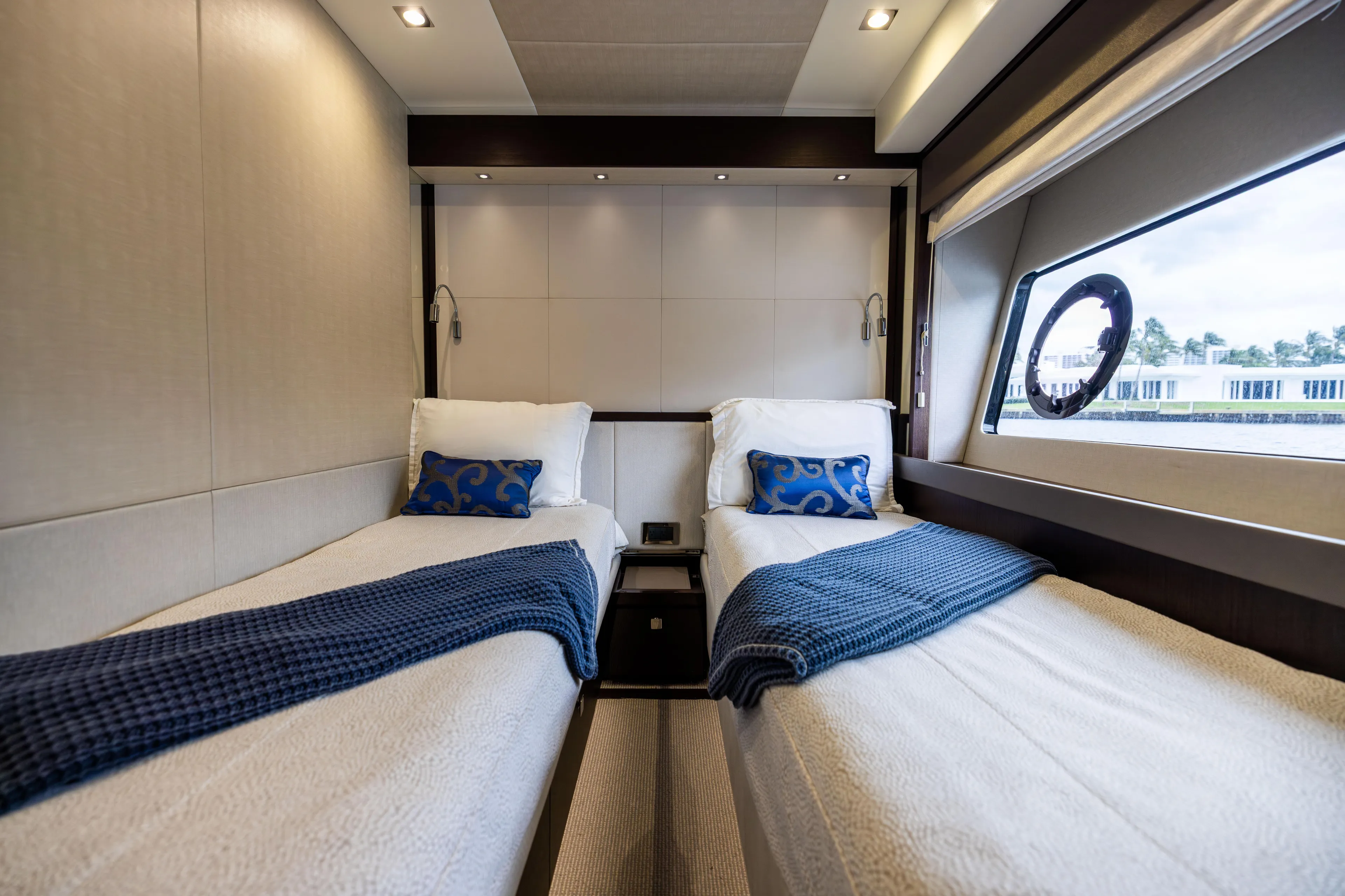 Journey Yacht Photos Pics Luxurious twin cabin interior on 2019 Sunseeker 76 yacht with elegant bedding and window view.