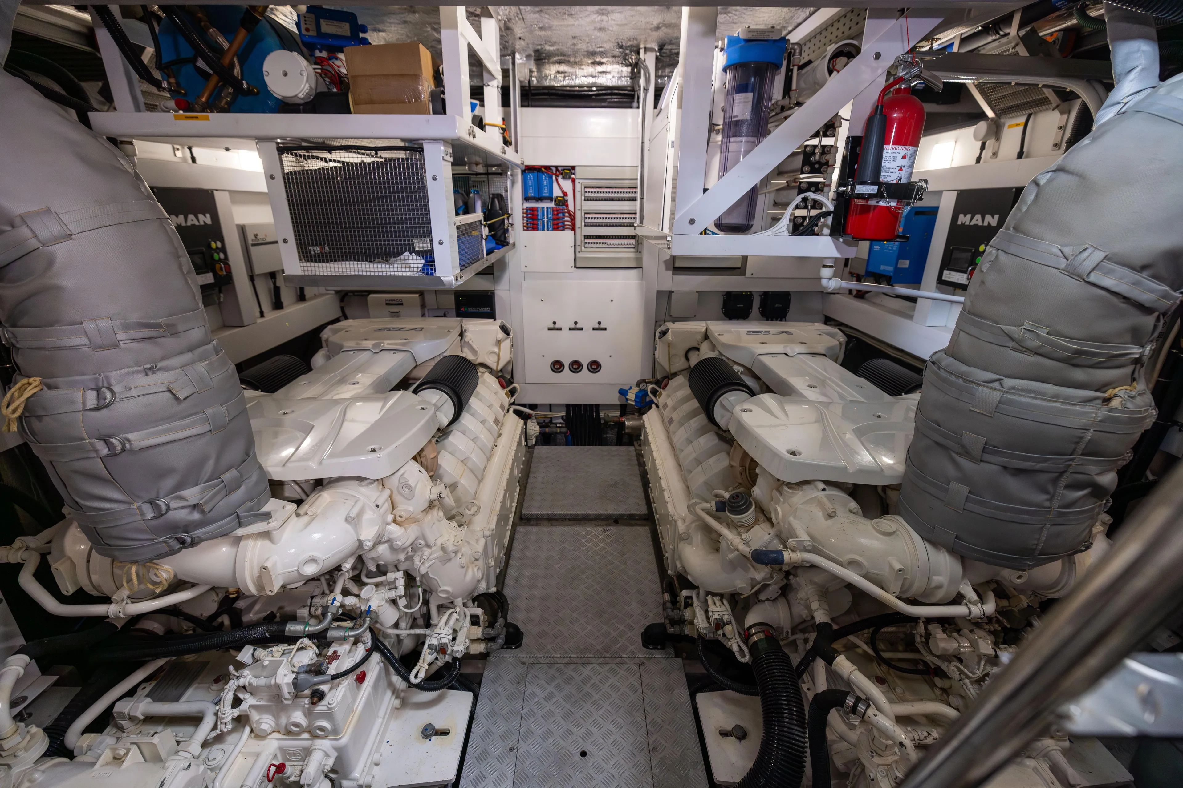 Journey Yacht Photos Pics Engine room of 2019 Sunseeker 76 yacht, featuring dual MAN engines and equipment.