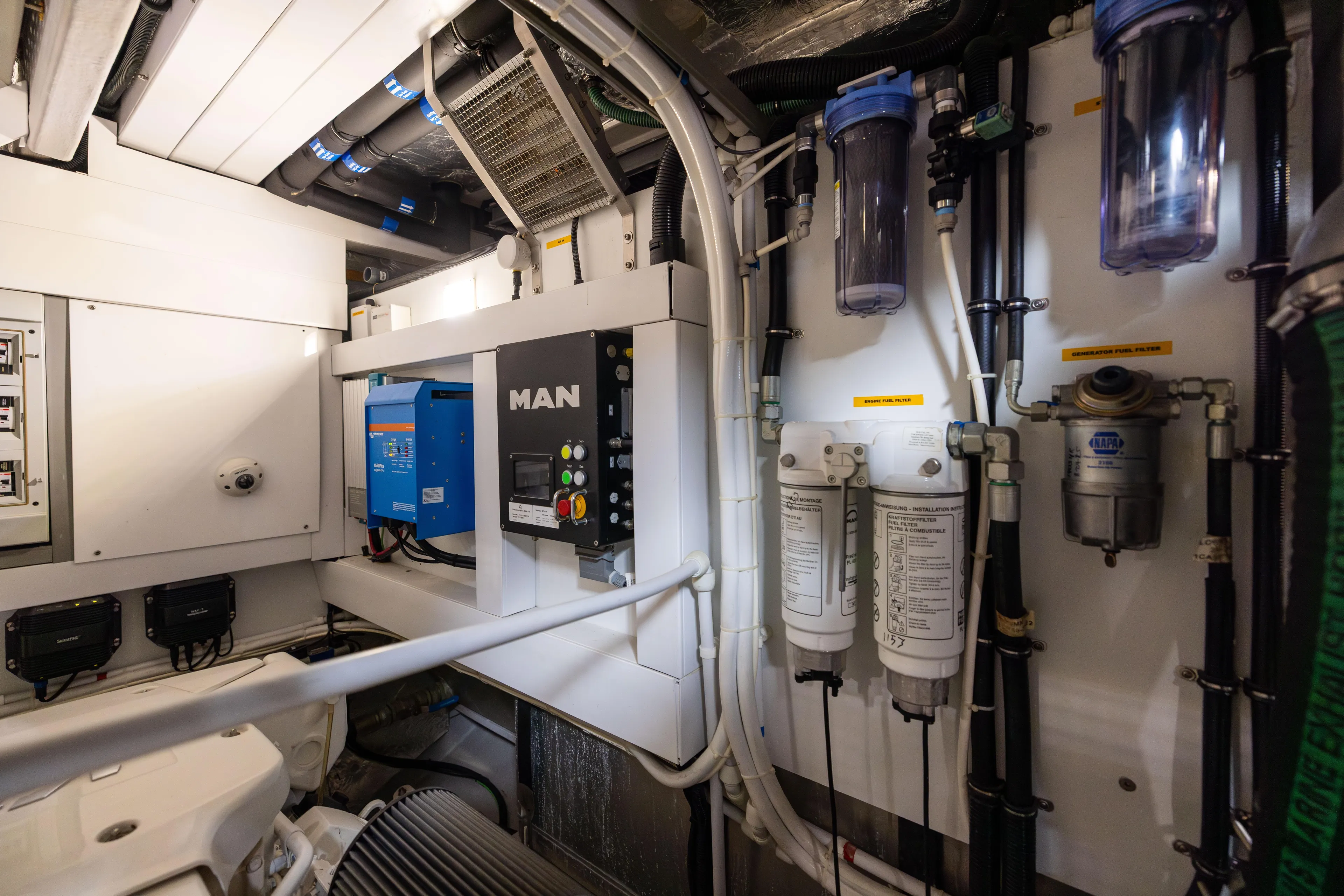 Journey Yacht Photos Pics Engine room of 2019 Sunseeker 76 yacht with MAN control panel and filters.