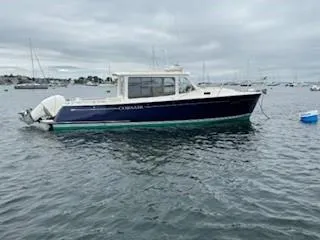 Corsair Yacht Photos Pics 2020 MJM 35z boat on water under cloudy sky.