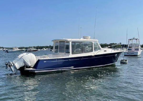Corsair Yacht Photos Pics 2020 MJM 35z boat with dual outboard engines on calm water.