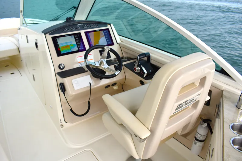  Yacht Photos Pics 2023 Boston Whaler 320 Vantage helm with modern controls and navigation displays.