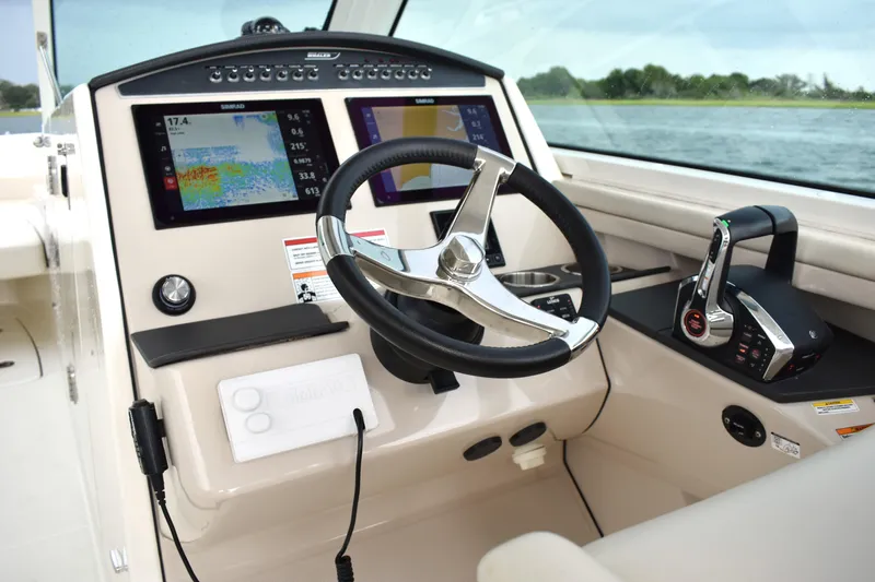  Yacht Photos Pics 2023 Boston Whaler 320 Vantage helm with modern controls and navigation displays.