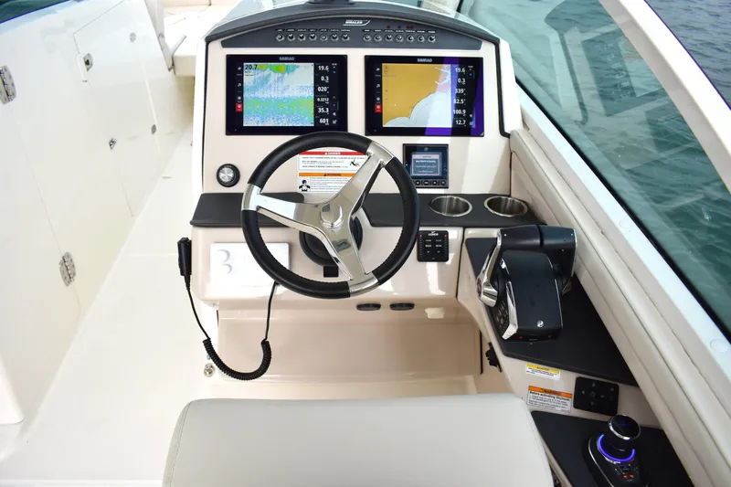  Yacht Photos Pics 2023 Boston Whaler 320 Vantage helm with advanced navigation displays and controls.