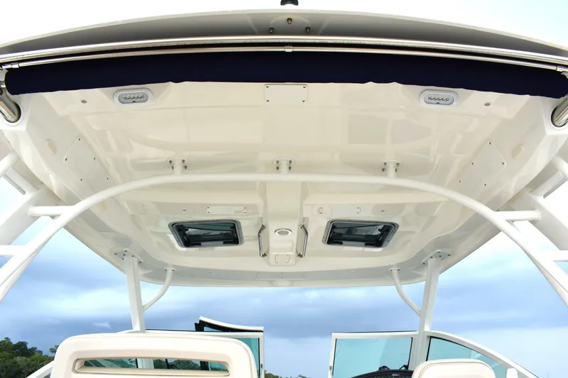  Yacht Photos Pics 2023 Boston Whaler 320 Vantage boat canopy with sleek design and integrated lighting.