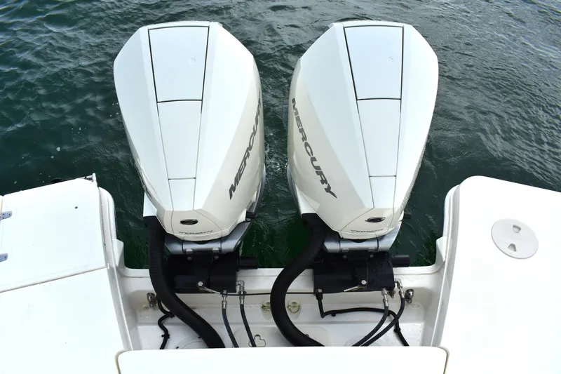  Yacht Photos Pics 2023 Boston Whaler 320 Vantage with dual Mercury outboard engines on water.