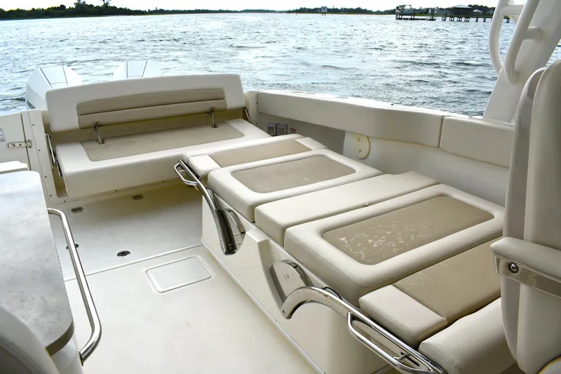  Yacht Photos Pics 2023 Boston Whaler 320 Vantage boat interior with comfortable seating and scenic water view.