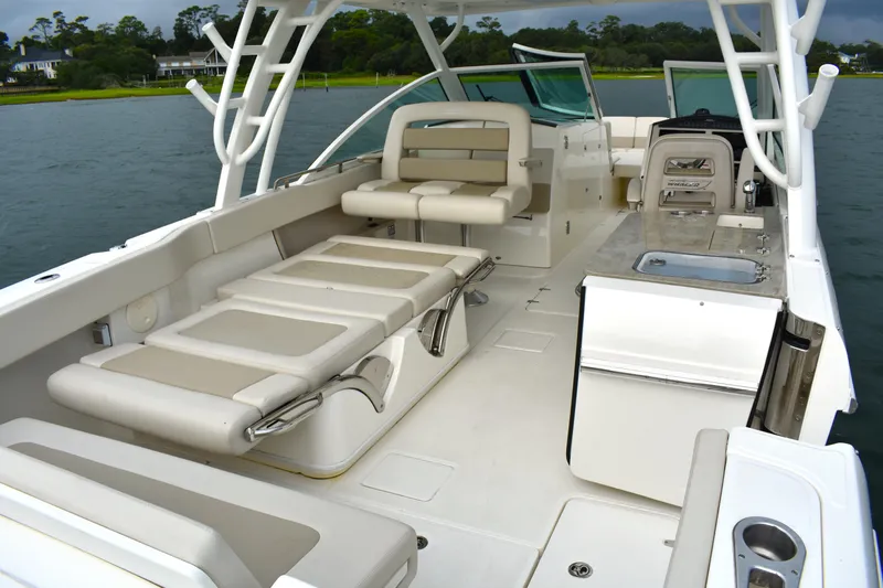  Yacht Photos Pics 2023 Boston Whaler 320 Vantage boat interior with seating and amenities.