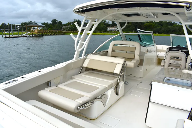  Yacht Photos Pics 2023 Boston Whaler 320 Vantage boat interior with seating and water view.
