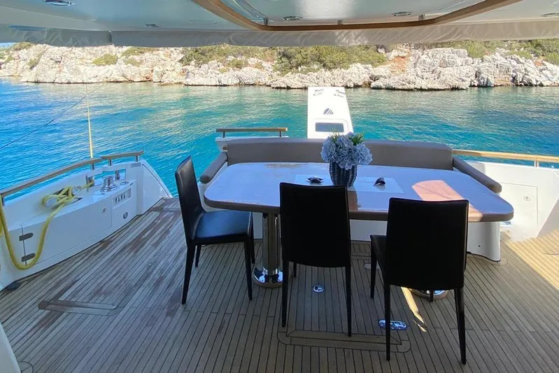  Yacht Photos Pics Luxury yacht Fairline Squadron 78, 2014 model, with elegant outdoor dining area and scenic ocean view.