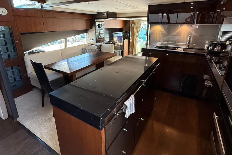  Yacht Photos Pics Luxurious interior of 2014 Fairline Squadron 78 yacht with modern kitchen and dining area.