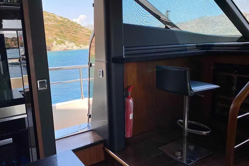  Yacht Photos Pics Interior view of 2014 Fairline Squadron 78 yacht with ocean backdrop.