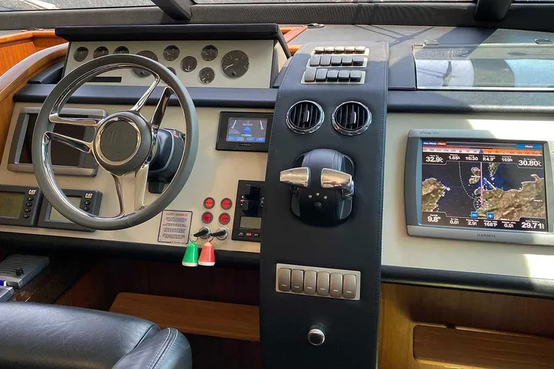  Yacht Photos Pics Cockpit of 2014 Fairline Squadron 78 yacht with navigation and control systems.