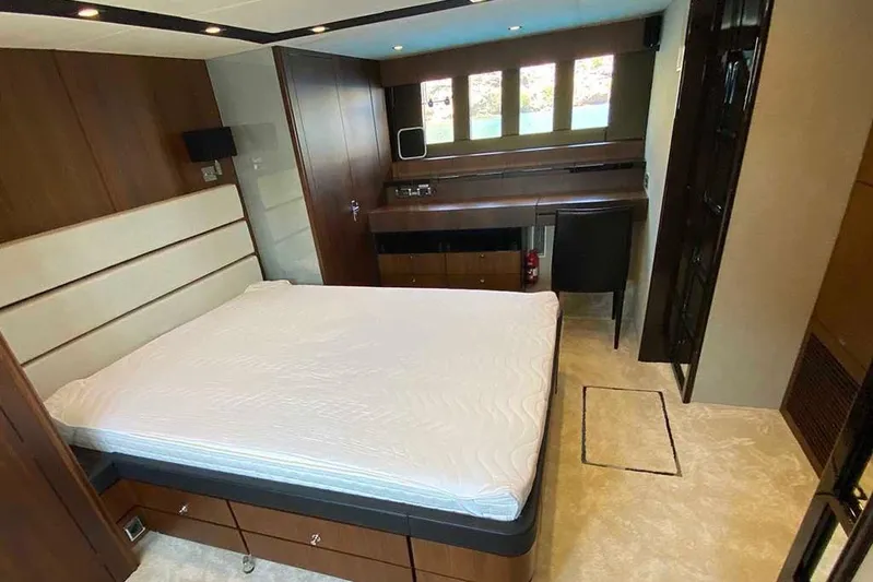  Yacht Photos Pics Luxurious bedroom interior of 2014 Fairline Squadron 78 yacht with modern furnishings.