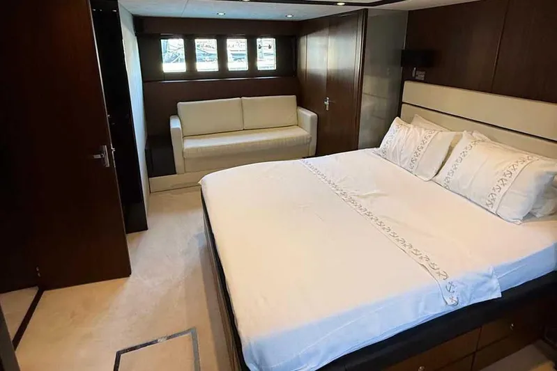  Yacht Photos Pics Luxurious bedroom interior of 2014 Fairline Squadron 78 yacht with elegant furnishings.