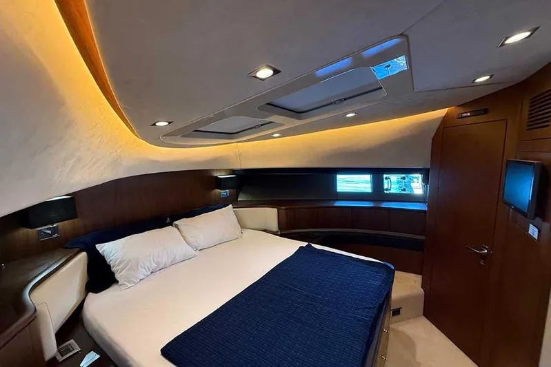  Yacht Photos Pics Luxurious cabin interior of 2014 Fairline Squadron 78 yacht with elegant bedding.