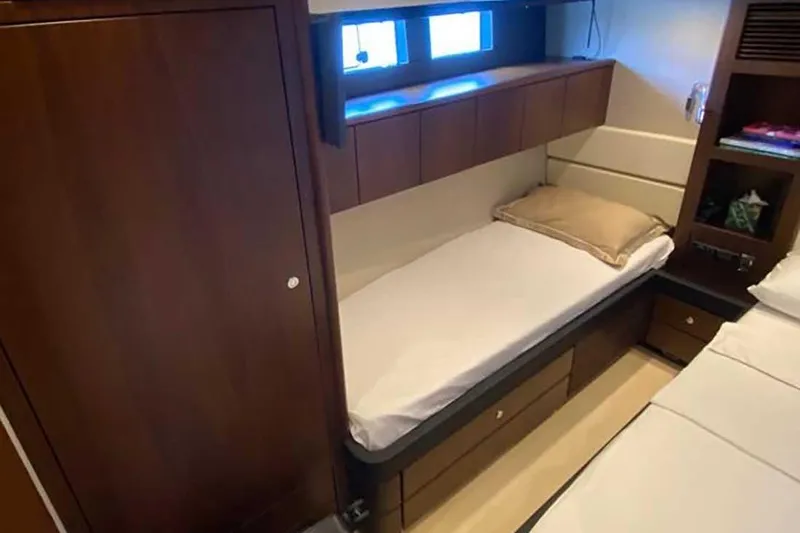  Yacht Photos Pics 2014 Fairline Squadron 78 cabin interior with single bed and wooden cabinetry.