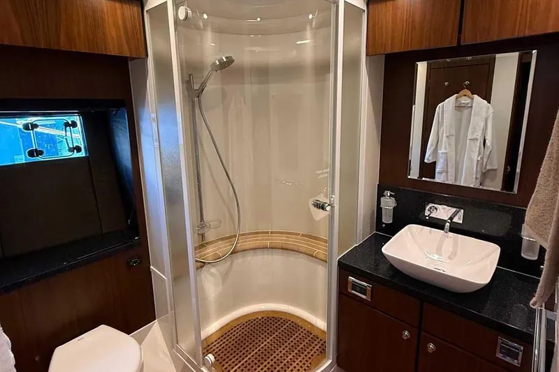  Yacht Photos Pics Luxurious bathroom in 2014 Fairline Squadron 78 yacht with modern shower and sink.