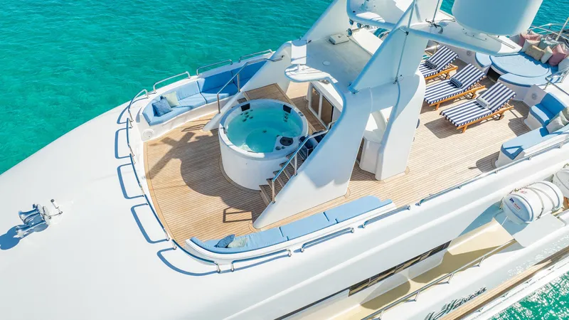 Island Heiress Yacht Photos Pics Luxurious Cheoy Lee 145 yacht deck with jacuzzi and sun loungers, 1996 model.