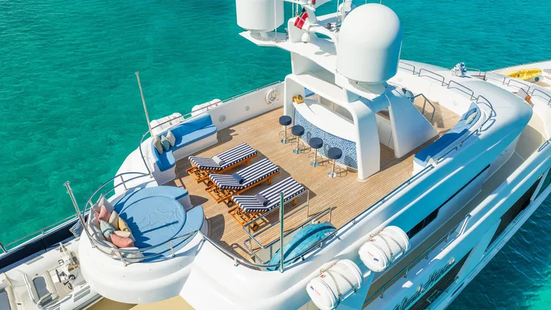 Island Heiress Yacht Photos Pics Luxurious 1996 Cheoy Lee 145 Global Series yacht with sun deck and bar, in turquoise waters.