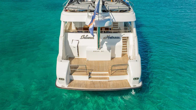 Island Heiress Yacht Photos Pics Luxury yacht Cheoy Lee 145 Global Series, 1996, on clear turquoise water.