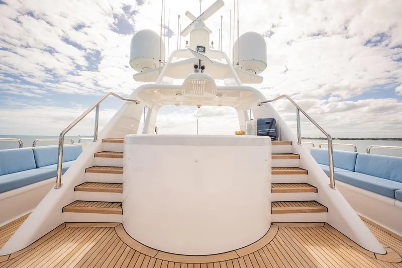 Island Heiress Yacht Photos Pics Luxurious deck of 1996 Cheoy Lee 145 Global Series yacht with elegant seating and stairs.