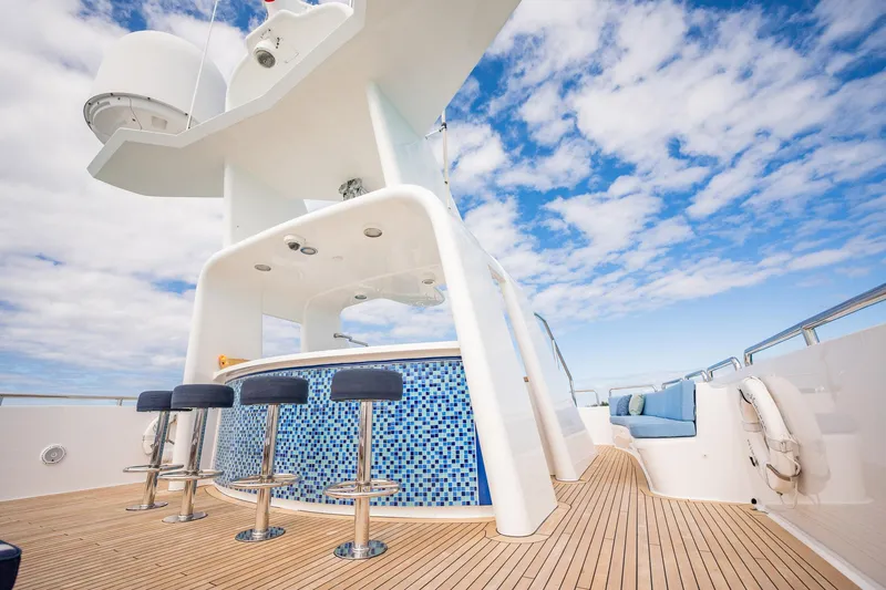 Island Heiress Yacht Photos Pics Luxurious deck of 1996 Cheoy Lee 145 Global Series yacht with bar and seating.