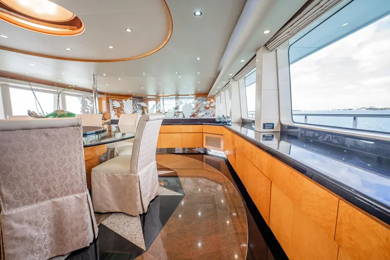 Island Heiress Yacht Photos Pics Luxurious interior of 1996 Cheoy Lee 145 Global Series yacht with elegant dining area.