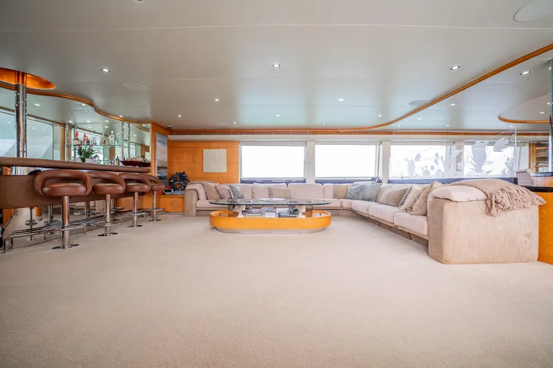 Island Heiress Yacht Photos Pics Luxurious interior of 1996 Cheoy Lee 145 Global Series yacht with spacious seating and bar area.