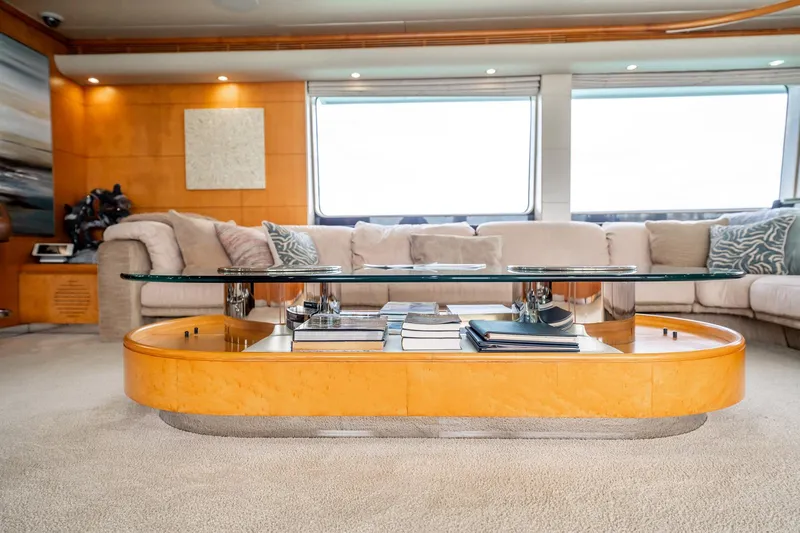 Island Heiress Yacht Photos Pics Luxurious interior of 1996 Cheoy Lee 145 Global Series yacht with elegant glass coffee table.