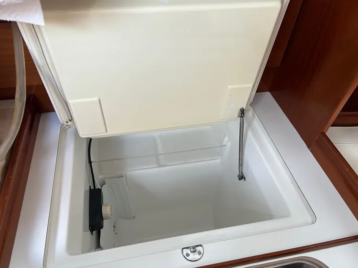 Flaneuse Yacht Photos Pics Open storage compartment in 2003 Beneteau 36.7 yacht interior.