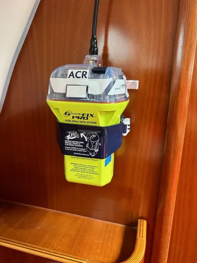 Flaneuse Yacht Photos Pics ACR GlobalFix Pro EPIRB mounted on 2003 Beneteau 36.7 yacht interior.
