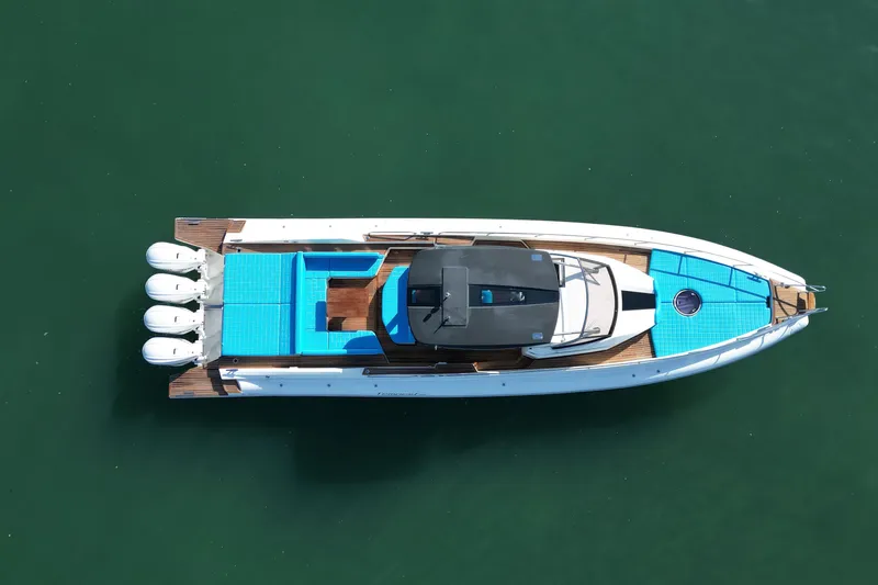 Inflation Yacht Photos Pics Aerial view of 2021 Capelli Tempest 50 boat with blue deck on water.