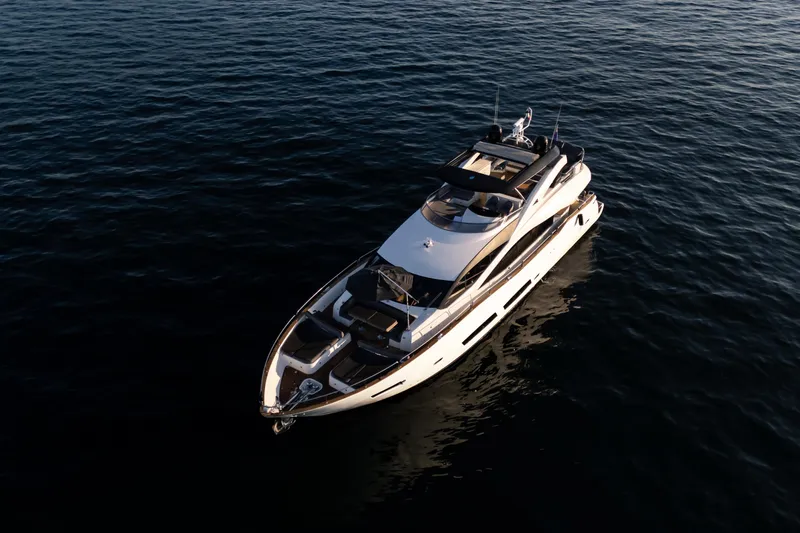 Kastelan Yacht Photos Pics 2015 Sunseeker 28 Metre Yacht cruising on calm waters at sunset.