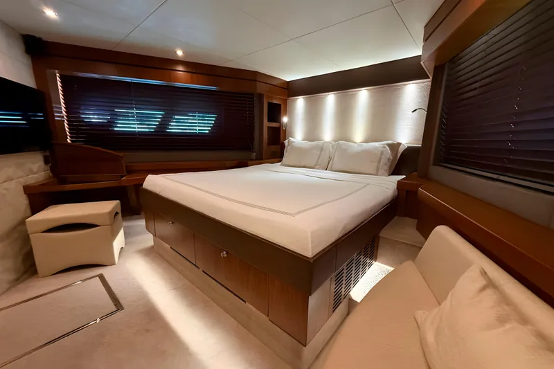 Kastelan Yacht Photos Pics Luxurious bedroom interior of 2015 Sunseeker 28 Metre Yacht with elegant wood finishes.