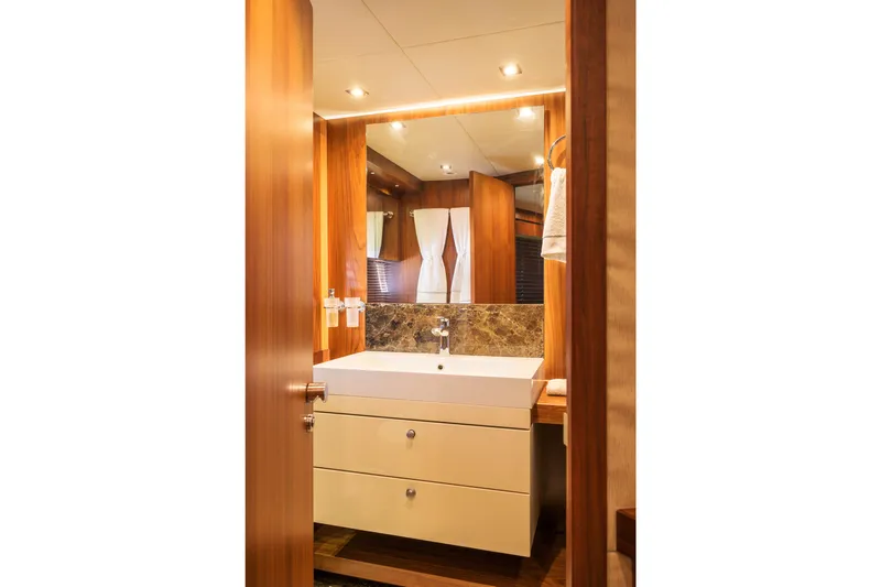 Kastelan Yacht Photos Pics Luxurious bathroom interior on 2015 Sunseeker 28 Metre Yacht, featuring modern sink and wood accents.
