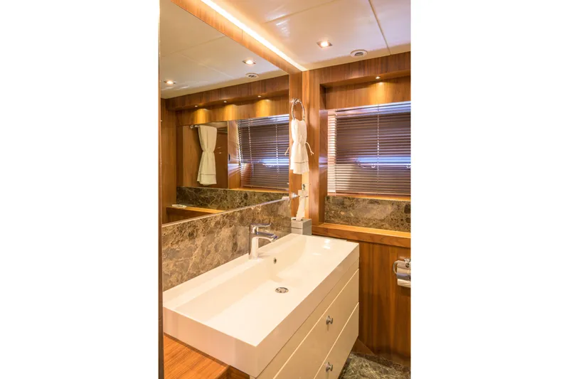 Kastelan Yacht Photos Pics Luxurious bathroom on 2015 Sunseeker 28 Metre Yacht with elegant wood and marble finishes.