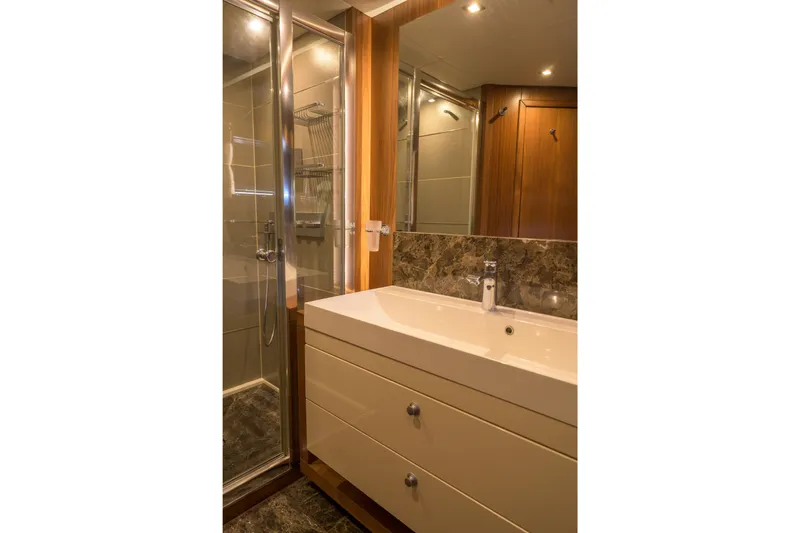 Kastelan Yacht Photos Pics Luxurious bathroom on 2015 Sunseeker 28 Metre Yacht with modern fixtures and elegant design.
