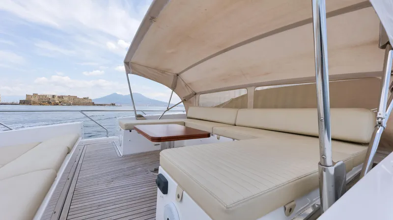 Elisa II Yacht Photos Pics Luxurious 2018 Azimut 77 S yacht deck with comfortable seating and scenic ocean view.