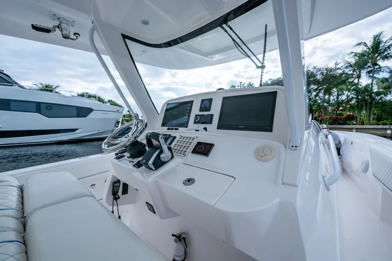 Mrs Diagnosis Yacht Photos Pics Intrepid 407 Panacea 2020 boat helm with modern controls and dual screens.