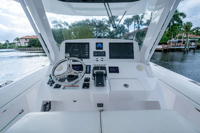 Mrs Diagnosis Yacht Photos Pics 2020 Intrepid 407 Panacea helm with advanced navigation systems and sleek design.
