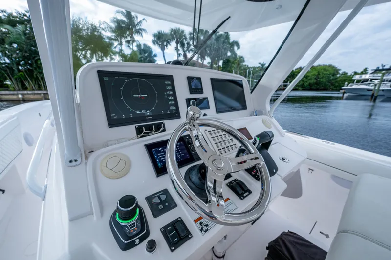 Mrs Diagnosis Yacht Photos Pics Helm of 2020 Intrepid 407 Panacea with advanced navigation controls and displays.