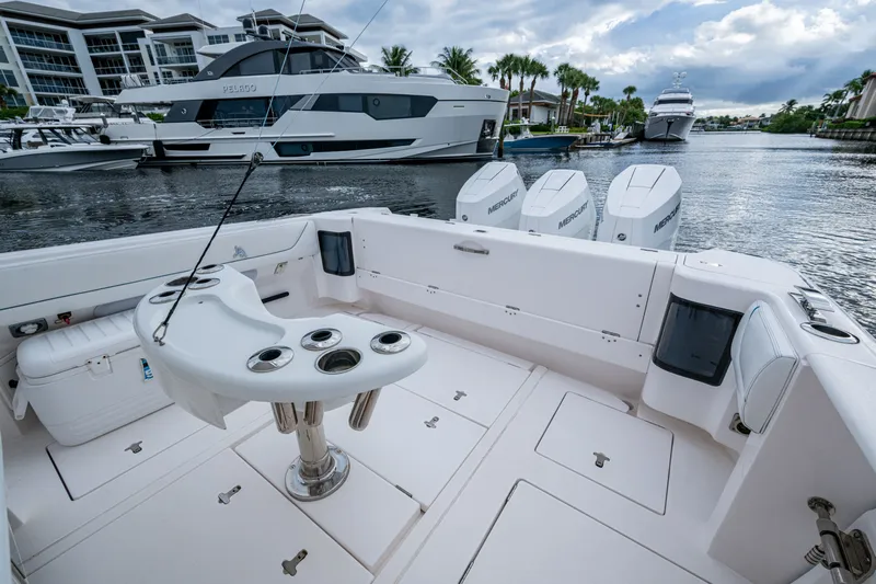 Mrs Diagnosis Yacht Photos Pics 2020 Intrepid 407 Panacea boat with fishing rod holders and Mercury engines docked in marina.