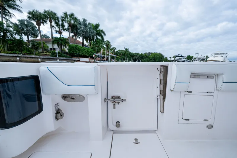 Mrs Diagnosis Yacht Photos Pics 2020 Intrepid 407 Panacea boat interior with white seating and storage compartments.